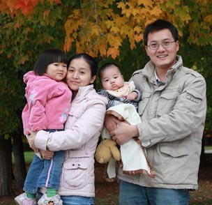 Picture of a family, in the fall, from Family Housing.